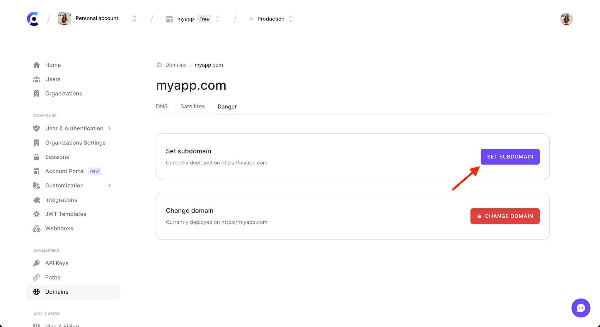 The 'Danger' tab of the Domains page in the Clerk Dashboard.There is a red arrow pointing to the 'Set subdomain' button.